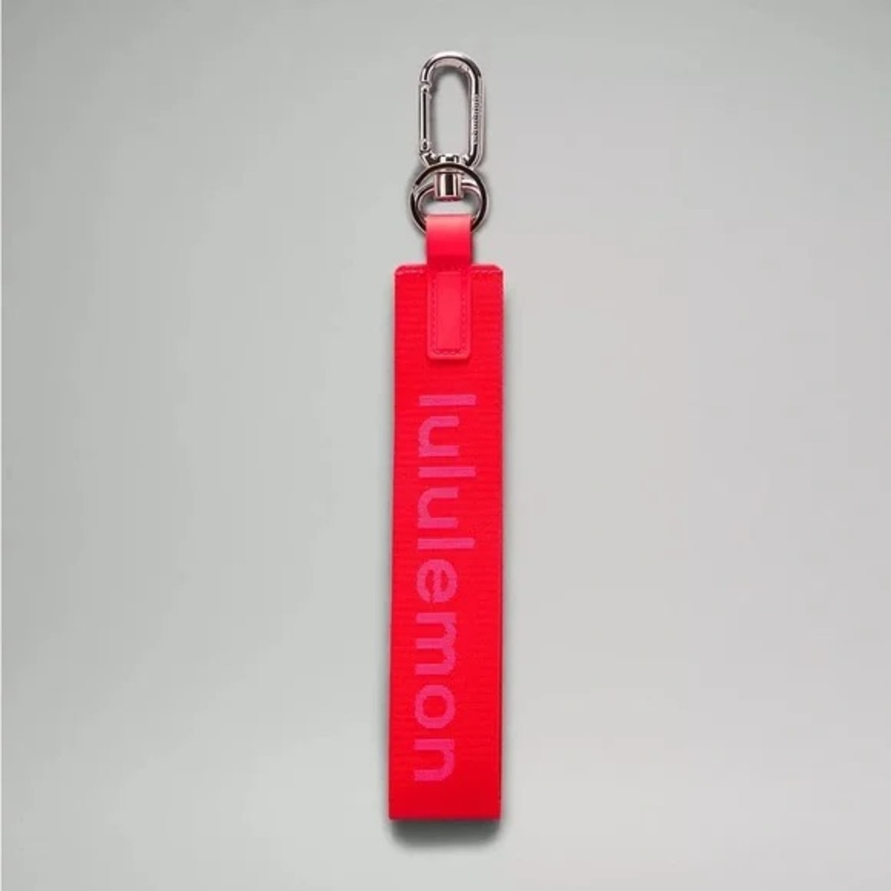 Lululemon neverlost keychain in Love red/ Sonic Pink